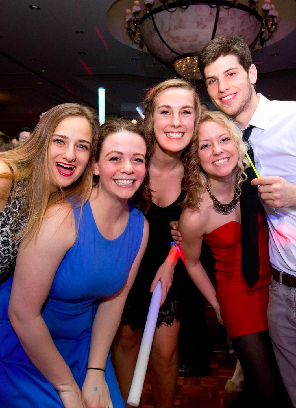 Five students at a formal U N E dance