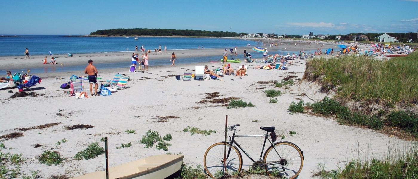 Sunbathers enjoy Kennebunkport Beach on a beautiful summer's day