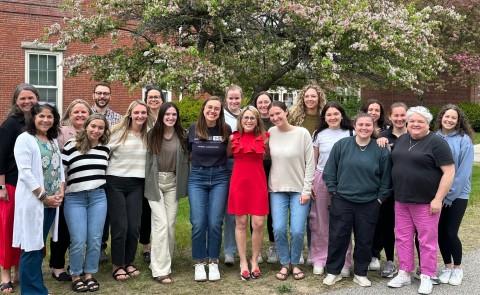 AOTA President Alyson Stover poses with students and faculty from UNE’s Department of Occupational Therapy