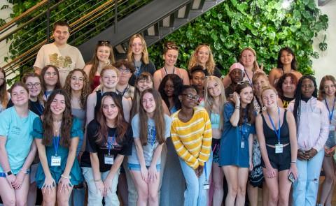 A group of high school students poses for a photo