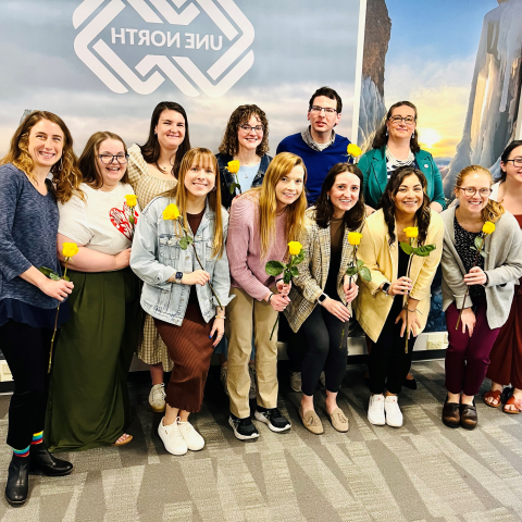 LEND trainees smiling with flowers